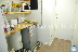 PF-TS: Vista de la puerta de acceso al apartamento junto a cocina