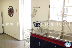 RE-RY: Kitchen and access to the interior patio with laundry area